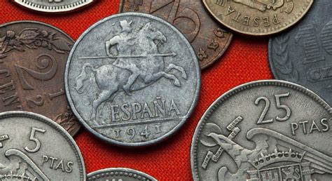 Monedas antiguas con la representación de un escudo