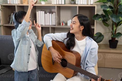 Thematic photo of a mother and child enjoying music together