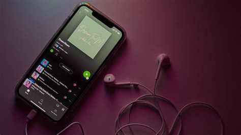 Thematic photo of a person making a music playlist on a phone or computer