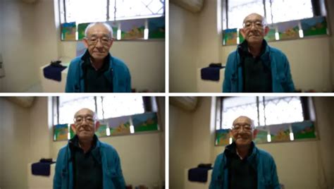 Retrato de Toshio Takata mostrando los dibujos que hace en su celda