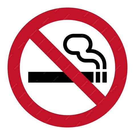 Imagen de una señal de prohibido fumar cannabis, junto a un edificio escolar.