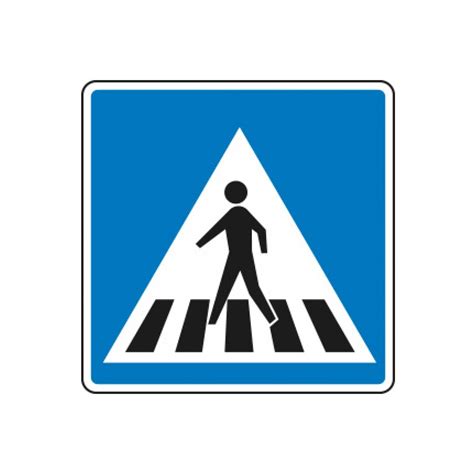 Foto de paso de cebra con señalética de precaución