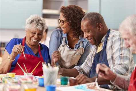Thematic photo of elderly people participating in a community activity, smiling and interacting