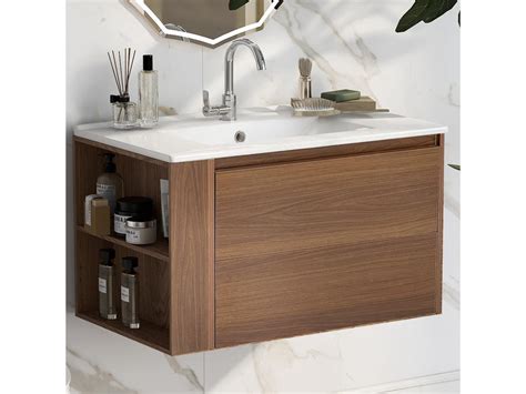 Fotografía de lavabo suspendido con grifo de palanca y espejo orientable
