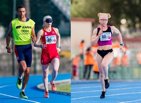 Para atleta con discapacidad visual corriendo en una pista, unido a su guía vidente