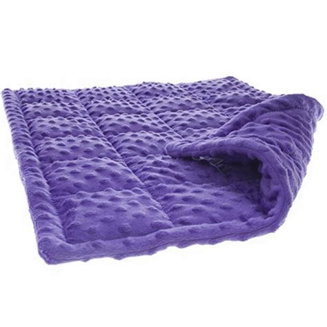 Manta sensorial con peso sobre una cama.
