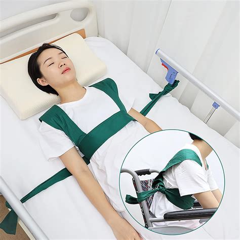 Imagen de un sistema de sujeción para cama, mostrando el cinturón abdominal y su fijación a la estructura de la cama