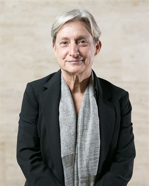 Ilustración conceptual de Judith Butler, rodeada de símbolos que representan la diversidad de género y la resistencia a la opresión.
